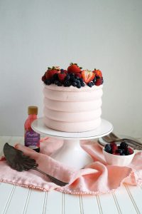 wild berry cake on stand