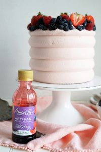 bottle of extract in front of cake