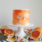 grapefruit poppyseed cake on stand