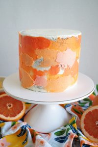 grapefruit cake on stand