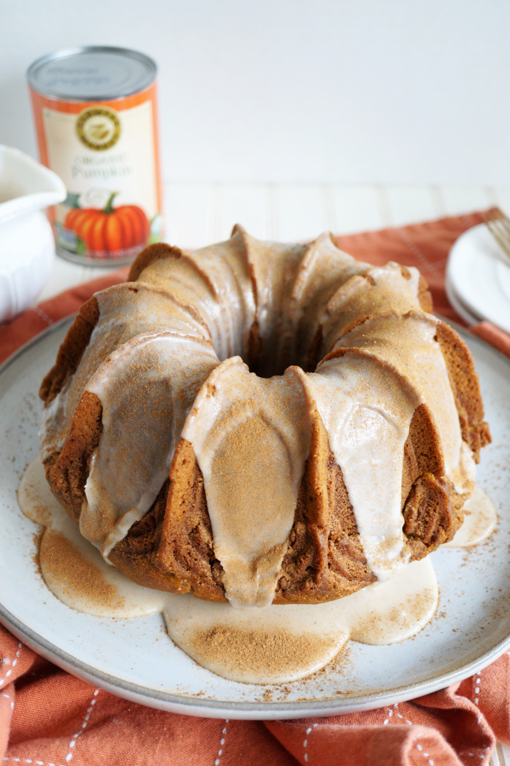 angled shot of pumpkin spice bundt cake on plate