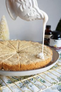 pouring glaze on cookie