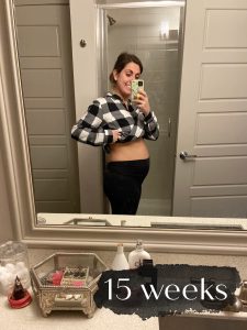 photo of woman with pregnant belly and label "15 weeks"
