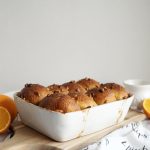 pan of morning buns on wooden cutting board