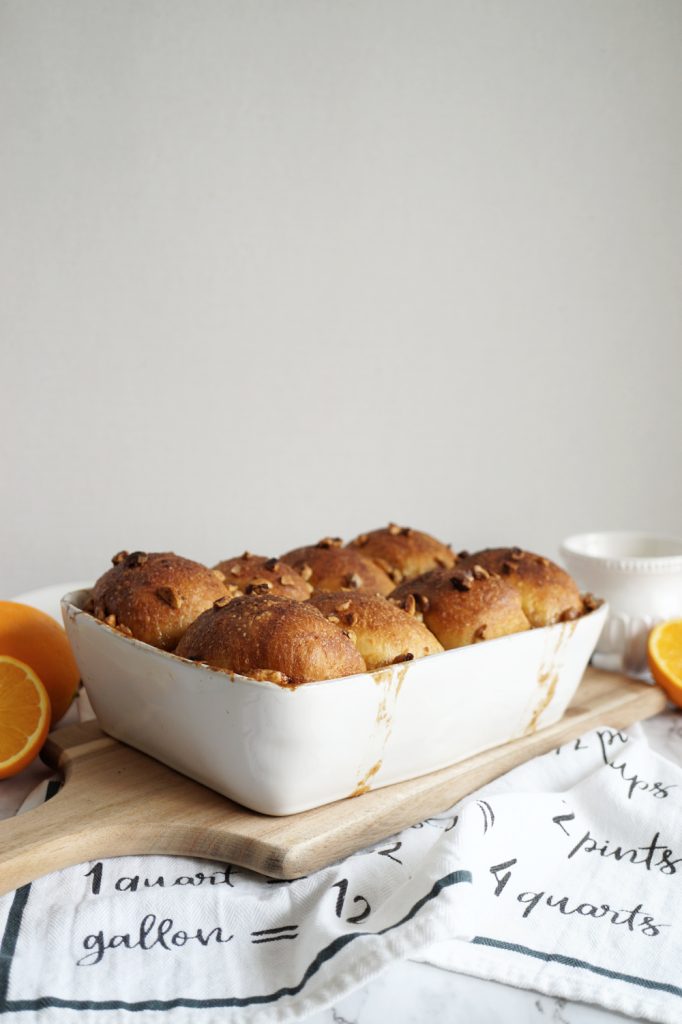 pan of morning buns on wooden cutting board