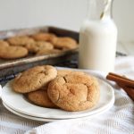 snickerdoodle cookies on plate with glass of milk
