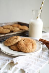 snickerdoodle cookies on plate with glass of milk