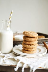 stack of snickerdoodle cookies on white plate