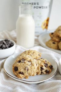 closer view of stacked oatmeal chocolate chip cookies on white plate