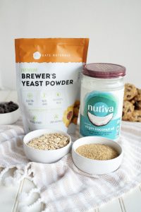 photo of ingredient containers including brewer's yeast, coconut oil, oats, and ground flaxseed